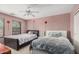 Charming bedroom with two beds, carpet flooring, and bright natural lighting at 4725 N 152Nd Dr, Goodyear, AZ 85395