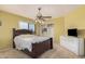 Comfortable bedroom features a ceiling fan, carpet flooring, and bright natural lighting at 4725 N 152Nd Dr, Goodyear, AZ 85395