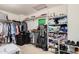 Walk-in closet with shelving and hanging storage for clothing and accessories at 4725 N 152Nd Dr, Goodyear, AZ 85395