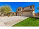Well-maintained two-story house with a three-car garage and landscaped front yard at 4725 N 152Nd Dr, Goodyear, AZ 85395