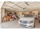 Spacious garage with storage, car, and open door at 4725 N 152Nd Dr, Goodyear, AZ 85395