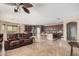 Open-concept space featuring a living room and a kitchen island with barstool seating at 4725 N 152Nd Dr, Goodyear, AZ 85395