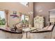 Elegant living room with high ceilings, large windows, and luxurious furnishings at 4725 N 152Nd Dr, Goodyear, AZ 85395