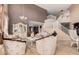 Elegant living room featuring soaring ceilings and a grand staircase at 4725 N 152Nd Dr, Goodyear, AZ 85395