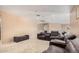 Cozy living room featuring recliner seating, carpet flooring, and bright natural lighting at 4725 N 152Nd Dr, Goodyear, AZ 85395