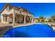 Stunning pool with lush landscaping, a covered patio, and perfect outdoor oasis at 4725 N 152Nd Dr, Goodyear, AZ 85395