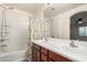 Bathroom featuring double sinks, a large mirror, and a shower-tub combination at 4786 E Laurel Ct, Gilbert, AZ 85234