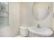 Simple half bathroom with oval mirror and sink at 4786 E Laurel Ct, Gilbert, AZ 85234