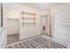 Bedroom with carpet flooring, closet, and bed frame; open to bathroom and closet at 4786 E Laurel Ct, Gilbert, AZ 85234