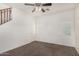 Bright bedroom with carpet, white walls, ceiling fan, and windows with blinds at 4786 E Laurel Ct, Gilbert, AZ 85234