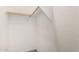 This is a walk-in closet with a wood rod for hanging clothes and white walls at 4786 E Laurel Ct, Gilbert, AZ 85234
