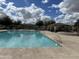 Expansive community pool and hot tub with ample seating and well-maintained deck at 4786 E Laurel Ct, Gilbert, AZ 85234