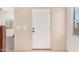 A clean entryway featuring a white door, neutral walls, and ceramic tile floors at 4786 E Laurel Ct, Gilbert, AZ 85234