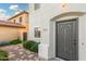 Close-up of the front door featuring desert landscaping and a two-story home at 4786 E Laurel Ct, Gilbert, AZ 85234