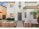 Charming two-story home featuring an inviting front door with decorative stone and lush landscaping at 4786 E Laurel Ct, Gilbert, AZ 85234