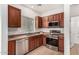 Kitchen boasts stainless steel appliances, tile backsplash, and abundant cabinet space at 4786 E Laurel Ct, Gilbert, AZ 85234