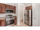 Stainless steel appliances and wood cabinets in this functional kitchen space at 4786 E Laurel Ct, Gilbert, AZ 85234