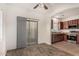 Open-concept kitchen featuring stainless steel appliances and dark wood cabinetry at 4786 E Laurel Ct, Gilbert, AZ 85234