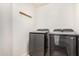 Laundry room featuring front-load washer and dryer and coat rack on the wall at 4786 E Laurel Ct, Gilbert, AZ 85234