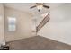 Inviting living room features neutral walls, modern ceiling fan, and carpeted floor at 4786 E Laurel Ct, Gilbert, AZ 85234