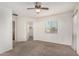Main bedroom featuring carpet flooring, a ceiling fan, and a walk-in closet at 4786 E Laurel Ct, Gilbert, AZ 85234