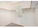 Walk-in closet providing ample storage space with wooden clothing racks at 4786 E Laurel Ct, Gilbert, AZ 85234