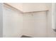 Walk-in closet with a window and wooden clothing rods for ample storage at 4786 E Laurel Ct, Gilbert, AZ 85234