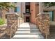 Building entrance with steps and stone details. Number 4803 displayed above entryway at 4803 N Woodmere Fairway -- # 2012, Scottsdale, AZ 85251