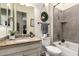 Bathroom with a granite countertop vanity, neutral tiling in the shower and toilet in the corner at 5114 S Leisure Ct, Gilbert, AZ 85298