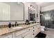 Bathroom featuring double sinks, granite countertops, a glass enclosed shower, and tile floors at 5114 S Leisure Ct, Gilbert, AZ 85298