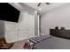 This bedroom features a large closet with sliding doors and neutral paint at 5114 S Leisure Ct, Gilbert, AZ 85298