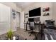 Bedroom with a wall-mounted TV, dual monitors, and a dark gaming desk and chair at 5114 S Leisure Ct, Gilbert, AZ 85298