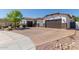 Paver driveway leads to a two-car garage, complemented by mature landscaping and a well-maintained stucco home at 5114 S Leisure Ct, Gilbert, AZ 85298