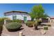 Manicured landscaping with mature bushes and rock ground cover enhance the curb appeal of this well-maintained home at 5114 S Leisure Ct, Gilbert, AZ 85298