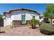 Landscaped front yard with mature bushes and rock ground cover enhance the curb appeal of this well-maintained home at 5114 S Leisure Ct, Gilbert, AZ 85298