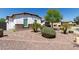 Well-maintained landscaping with mature bushes and rock ground cover enhance the curb appeal of this well-maintained home at 5114 S Leisure Ct, Gilbert, AZ 85298