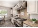 Gourmet kitchen with professional-grade appliances, granite countertops, and stylish cabinetry at 5114 S Leisure Ct, Gilbert, AZ 85298