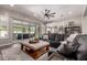 Bright living room with access to an outdoor patio, featuring a cozy seating area and modern decor at 5114 S Leisure Ct, Gilbert, AZ 85298