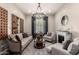 Inviting living room with stylish chandelier, fireplace, and comfortable seating area at 5114 S Leisure Ct, Gilbert, AZ 85298