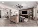 Spacious living room with contemporary design, including sleek furniture and a large-screen TV at 5114 S Leisure Ct, Gilbert, AZ 85298