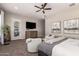 Inviting main bedroom with ceiling fan, plantation shutters, and a view to the backyard at 5114 S Leisure Ct, Gilbert, AZ 85298