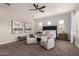 Comfortable main bedroom features a ceiling fan, plantation shutters and stylish wall decor at 5114 S Leisure Ct, Gilbert, AZ 85298