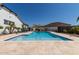 Inviting pool with a basketball hoop and plenty of room for relaxing, surrounded by lounge chairs and palm trees at 5114 S Leisure Ct, Gilbert, AZ 85298