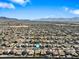 Neighborhood aerial view with mountain backdrop, showcasing the property's location within a well-planned community at 5318 W Grenadine Rd, Laveen, AZ 85339