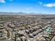 Expansive aerial view of a suburban neighborhood with mountain views and blue sky at 5318 W Grenadine Rd, Laveen, AZ 85339