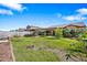 Expansive backyard with a pergola, well-manicured lawn, and mature trees providing shade and privacy at 5318 W Grenadine Rd, Laveen, AZ 85339