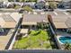 Aerial shot of backyard featuring green grass, seating area, fire pit, and pool at 5318 W Grenadine Rd, Laveen, AZ 85339
