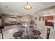 Open concept with dining room and living room, providing an airy and connected space for meals and relaxation at 5318 W Grenadine Rd, Laveen, AZ 85339