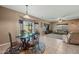 Open concept with dining room and living room features tile floors, and an airy feel at 5318 W Grenadine Rd, Laveen, AZ 85339