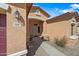 Welcoming home entrance with well-kept desert landscaping and a charming entryway at 5318 W Grenadine Rd, Laveen, AZ 85339